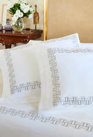 Detail of Versa Duvet Cover Set – geometric embroidered border on Egyptian cotton pillow shams and top sheet.