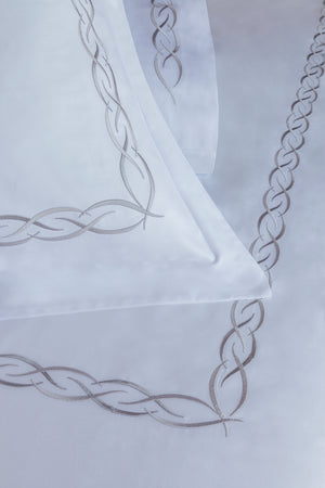 Detail of Ava Duvet Cover Set – elegant linked loop embroidered border on Egyptian cotton pillow shams and top sheet.