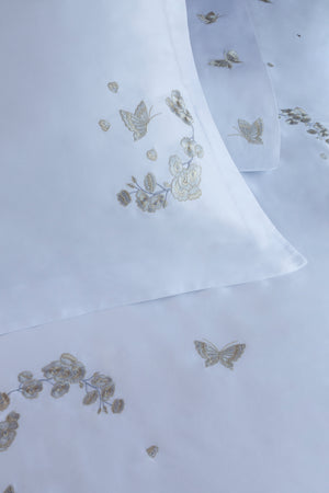 Detail of Butterfly Blossom Duvet Cover Set – butterfly embroidered on Egyptian cotton pillow shams and top sheet.