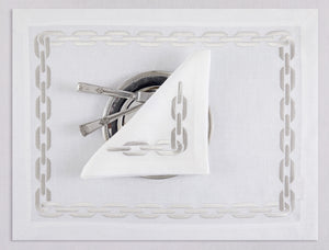 White linen placemat and napkin set embroidered with silver chain motif border, 100% European linen, handcrafted by Plein Soleil.