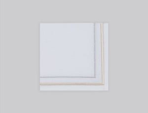 White linen cocktail napkin embroidered with gold and silver line motif border, 100% European linen, handcrafted by Plein Soleil.