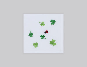 White linen cocktail napkin set embroidered with green cloves, 100% European linen, handcrafted by Plein Soleil.