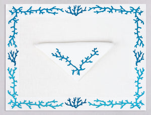 White linen placemat and napkin set embroidered with blue coral frame, 100% European linen, handcrafted by Plein Soleil.