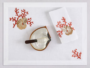 White linen placemat and napkin set embroidered with red coral and ivory shell, 100% European linen, handcrafted by Plein Soleil.
