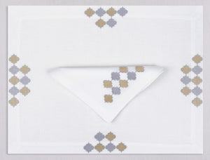 White linen placemat and napkin set embroidered with gold and silver damas motif, 100% European linen, handcrafted by Plein Soleil.