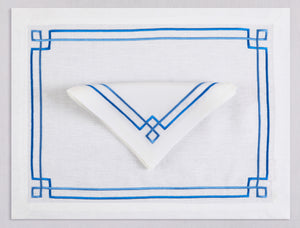 White linen placemat and napkin set embroidered with blue greek key motif border, 100% European linen, handcrafted by Plein Soleil.