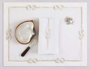 White linen placemat and napkin set embroidered with ivory sailor's knot, 100% European linen, handcrafted by Plein Soleil.