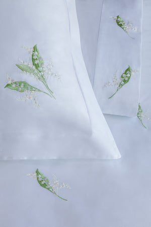Detail of Lily of the Valley Duvet Cover Set – lily embroidered on Egyptian cotton pillow shams and top sheet.