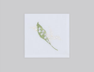 White linen cocktail napkin set embroidered with white and green lily flowers, 100% European linen, handcrafted by Plein Soleil.