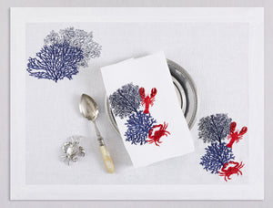 White linen placemat and napkin set embroidered with navy corals and red lobster and crab, 100% European linen, handcrafted by Plein Soleil.