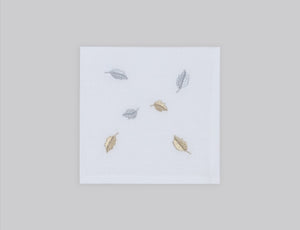 White linen cocktail napkin set embroidered with gold and silver small leaves, 100% European linen, handcrafted by Plein Soleil.