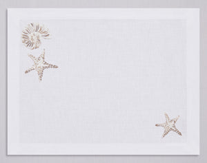 White linen placemat and napkin set embroidered with ivory starfish and nautilus, 100% European linen, handcrafted by Plein Soleil.