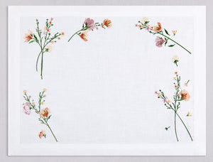 White linen placemat and napkin set embroidered with dark pink flowers, 100% European linen, handcrafted by Plein Soleil.