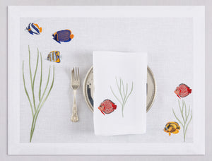 White linen placemat and napkin set embroidered with colorful tropic fish, 100% European linen, handcrafted by Plein Soleil.