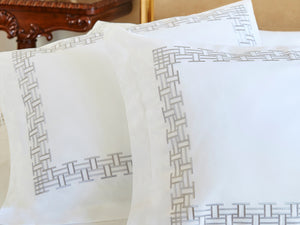 Detail of Versa Duvet Cover Set – geometric embroidered border on Egyptian cotton pillow shams and top sheet.