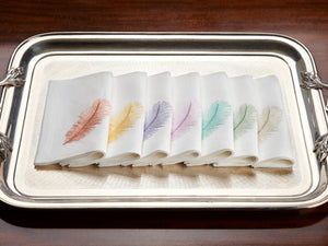 Set of white linen guest towels embroidered with purple, yellow, and pink thistle flowers – luxury floral bath linens by Plein Soleil.