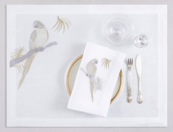 White linen placemat and napkin set embroidered with gold and silver macau bird, 100% European linen, handcrafted by Plein Soleil.