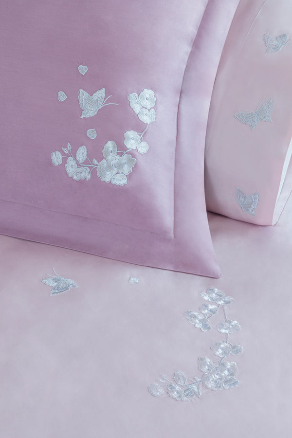 Detail of Butterfly Blossom Duvet Cover Set – butterfly embroidered on Egyptian cotton pillow shams and top sheet.