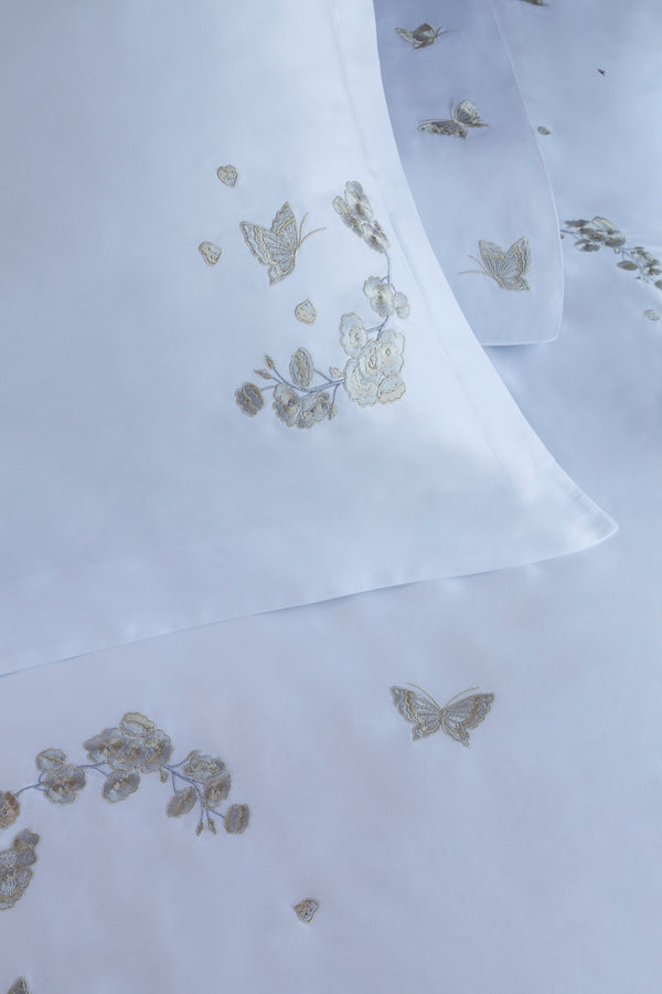 Detail of Butterfly Blossom Duvet Cover Set – butterfly embroidered on Egyptian cotton pillow shams and top sheet.