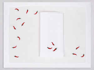 White linen placemat and napkin set embroidered with red cayenne peppers, 100% European linen, handcrafted by Plein Soleil.