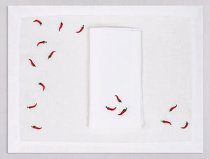 White linen placemat and napkin set embroidered with red cayenne peppers, 100% European linen, handcrafted by Plein Soleil.