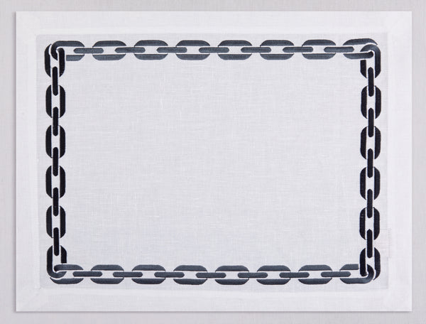 White linen placemat and napkin set embroidered with anthracite chain motif border, 100% European linen, handcrafted by Plein Soleil.