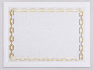 White linen placemat and napkin set embroidered with gold chain motif border, 100% European linen, handcrafted by Plein Soleil.