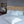 Cherry Blossom Duvet Cover Set in light gray Egyptian cotton with flower embroidery – flanged shams and pillowcases on bed, styled in luxury bedroom.