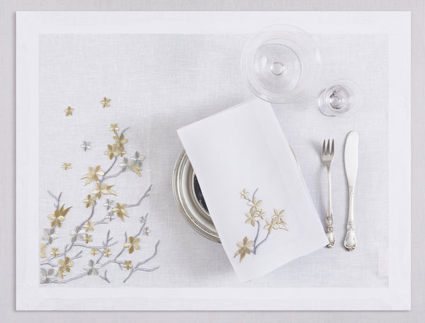 White linen placemat and napkin set embroidered with gold and silver cherry flowers, 100% European linen, handcrafted by Plein Soleil.