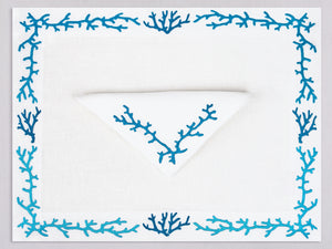 White linen placemat and napkin set embroidered with blue coral frame, 100% European linen, handcrafted by Plein Soleil.