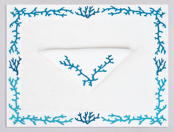 White linen placemat and napkin set embroidered with blue coral frame, 100% European linen, handcrafted by Plein Soleil.
