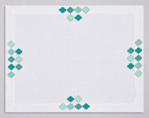 White linen placemat and napkin set embroidered with emerald damas motif, 100% European linen, handcrafted by Plein Soleil.