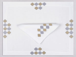 White linen placemat and napkin set embroidered with gold and silver damas motif, 100% European linen, handcrafted by Plein Soleil.