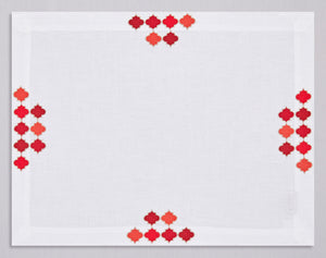 White linen placemat and napkin set embroidered with red damas motif, 100% European linen, handcrafted by Plein Soleil.
