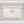 White linen placemat and napkin set embroidered with gold damasque motif border, 100% European linen, handcrafted by Plein Soleil.