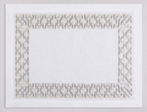 White linen placemat and napkin set embroidered with silver damasque motif border, 100% European linen, handcrafted by Plein Soleil.