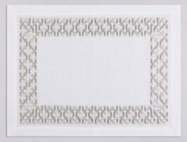 White linen placemat and napkin set embroidered with silver damasque motif border, 100% European linen, handcrafted by Plein Soleil.