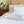 Deco Duvet Cover Set in white Egyptian cotton with Art Deco-inspired geometric embroidery – flanged shams and pillowcases on bed, styled in luxury bedroom.