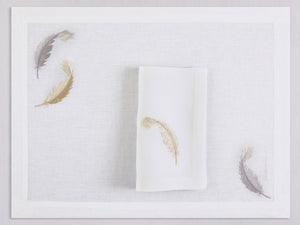 White linen placemat and napkin set embroidered with gold and silver feathers, 100% European linen, handcrafted by Plein Soleil.