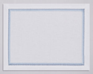 White linen placemat and napkin set embroidered with ice blue fluffy frame border, 100% European linen, handcrafted by Plein Soleil.
