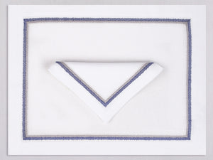 White linen placemat and napkin set embroidered with navy fluffy frame border, 100% European linen, handcrafted by Plein Soleil.