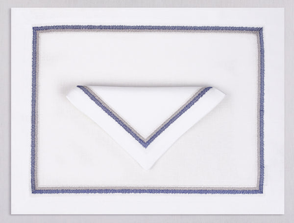 White linen placemat and napkin set embroidered with navy fluffy frame border, 100% European linen, handcrafted by Plein Soleil.