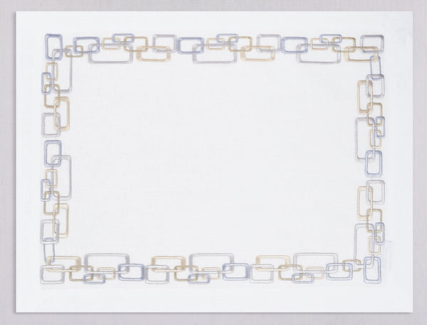 White linen placemat and napkin set embroidered with gold and silver geometric motif border, 100% European linen, handcrafted by Plein Soleil.