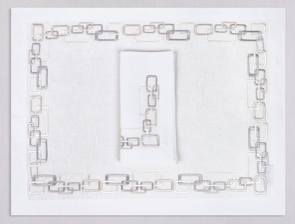 White linen placemat and napkin set embroidered with ivory geometric motif border, 100% European linen, handcrafted by Plein Soleil.