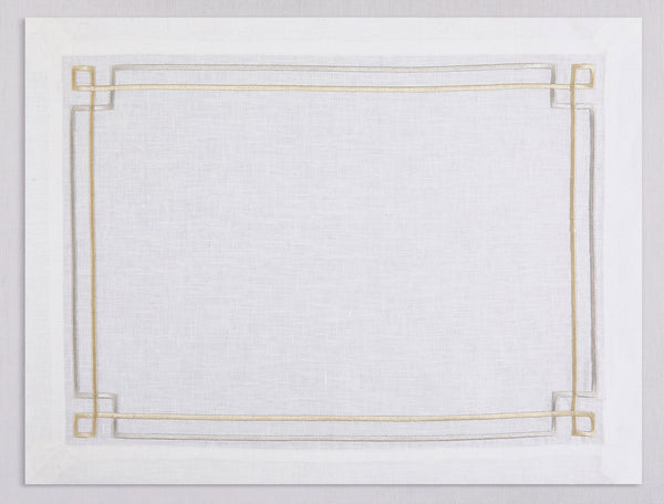 White linen placemat and napkin set embroidered with gold and silver greek key motif border, 100% European linen, handcrafted by Plein Soleil.