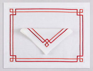 White linen placemat and napkin set embroidered with red greek key motif border, 100% European linen, handcrafted by Plein Soleil.