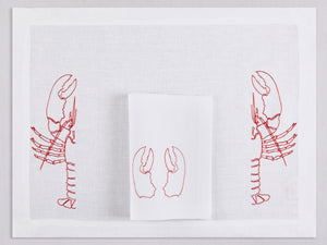 White linen placemat and napkin set embroidered with red half lobsters, 100% European linen, handcrafted by Plein Soleil.