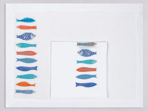 White linen placemat and napkin set embroidered with colorful fish, 100% European linen, handcrafted by Plein Soleil.