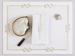White linen placemat and napkin set embroidered with ivory sailor's knot, 100% European linen, handcrafted by Plein Soleil.