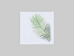 White linen cocktail napkin embroidered with green le sud leaves, 100% European linen, handcrafted by Plein Soleil.